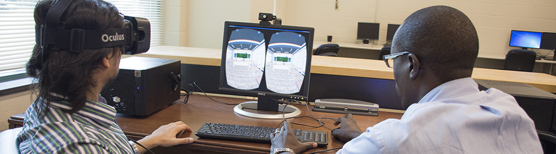 Conrad Tucker and an industrial engineering student in the DATA Lab at Penn State.