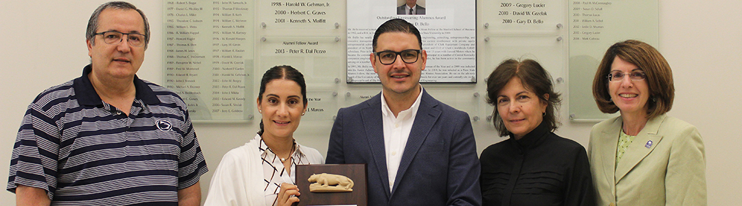 2017 PSIMES GOLD Award recipient Abraham Mendoza receives his award. He is joined by his wife, his former adviser Professor Jose Ventura, Department Head Janis Terpenny, and PSIMES member Terri Green.