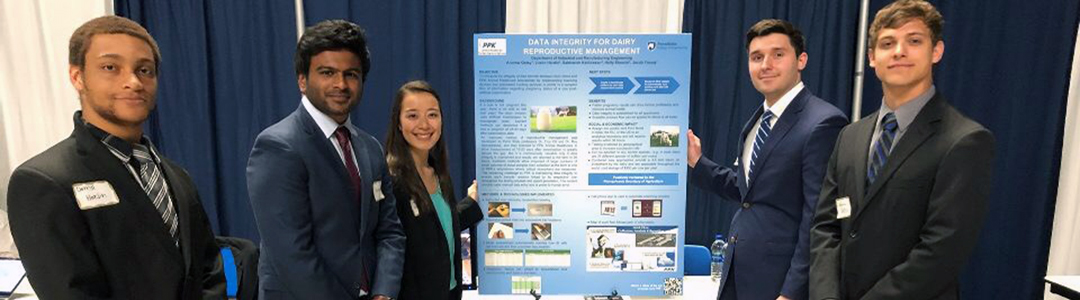 Industrial Engineering students stand with research poster