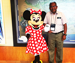 chandra with minnie mouse at a conference