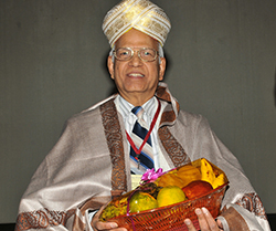 ravindran being honored at an international symposium
