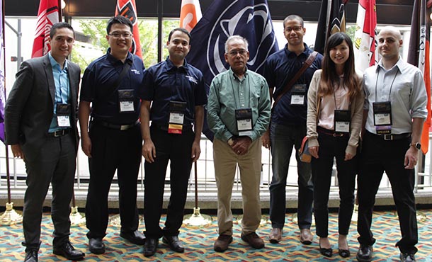 students and faculty at conference