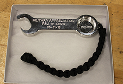 The opposite side of a bottle opener/wrench made in the Factory for Advanced Manufacturing Education within the Harold and Inge Marcus Department of Industrial and Manufacturing Engineering for Military Appreciation Day donors. 