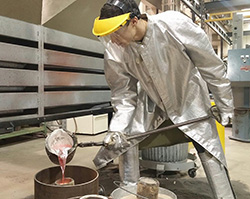 Zuber pouring molten aluminum into a foam cast during one of the Lost Foam Foundry Night events held this semester in the Factory for Advanced Manufacturing Education. 