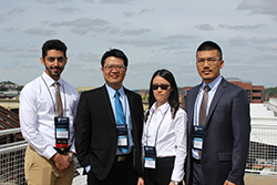 Osama Alotaik, Cheng-Bang Chen, Bing Yao and Xin Li with the Pittsburgh skyline in the background