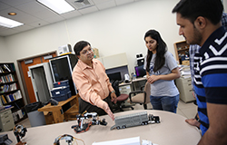 Professor Vittal Prabhu talks with two of his graduate students