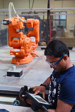 Badarinath works with an ABB robot