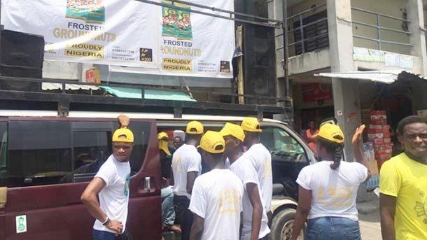 L&L Foods employees work to promote the company and its nut offerings in Nigeria.