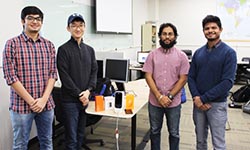 research team members pose in lab