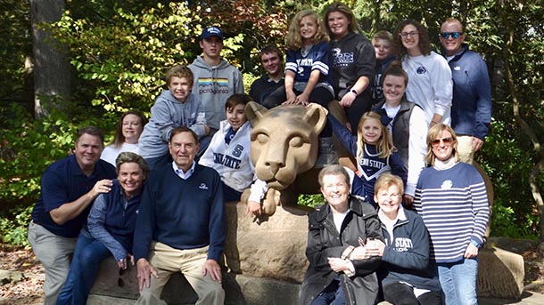 chuck schneider and his extended family at the Nittany Lion Shrine